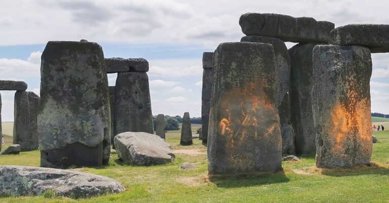 Climate protesters arrested after spraying Stonehenge with orange paint